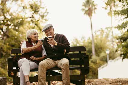 FAQs- Elderly couples sitting in garden. 